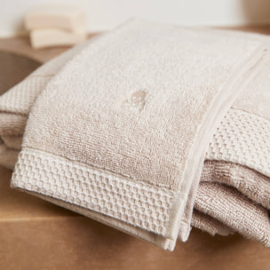 Juego de toallas nidus (30x50cm + 50x100cm + 90x150cm) 100% algodón en color crema con logo bordado scalpers home