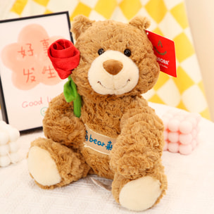Peluche extra morbido e soffice. Design orso che tiene una rosa. 28 cm.