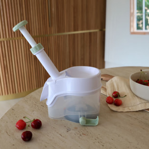 Dénoyauteur à cerise avec réservoir