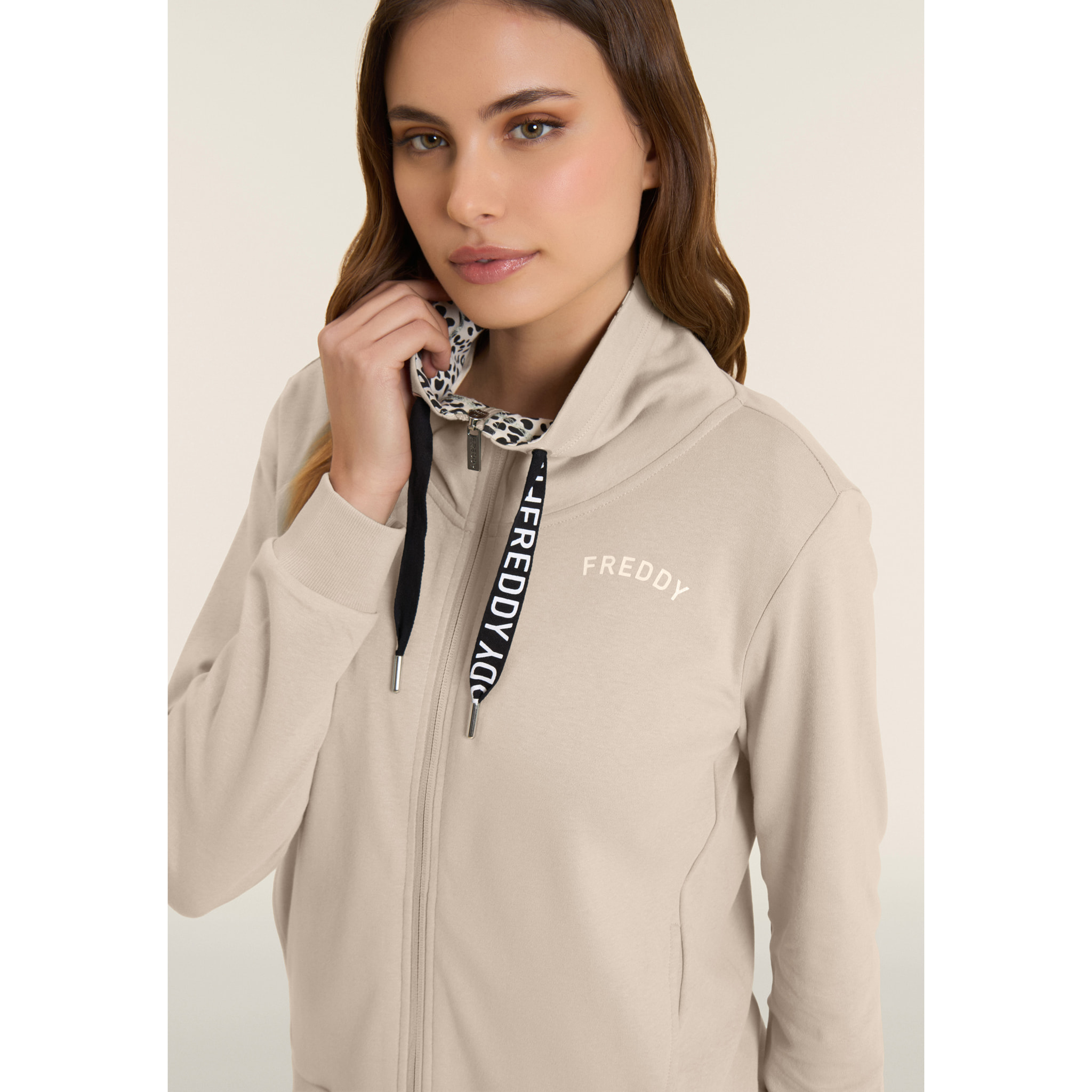 Tuta con zip e collo alto con interno animalier