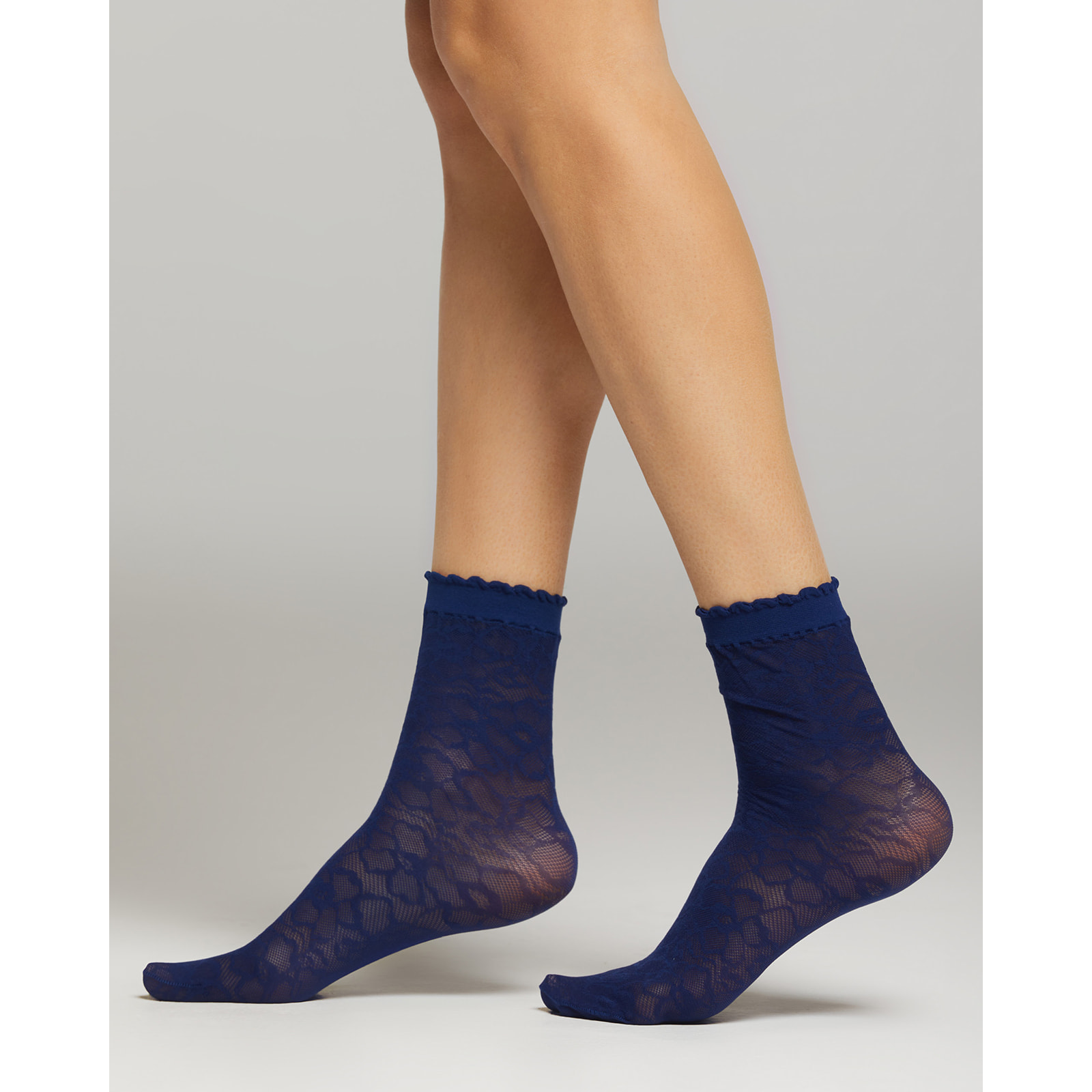 Calza Miuccia con motivo pizzo macro