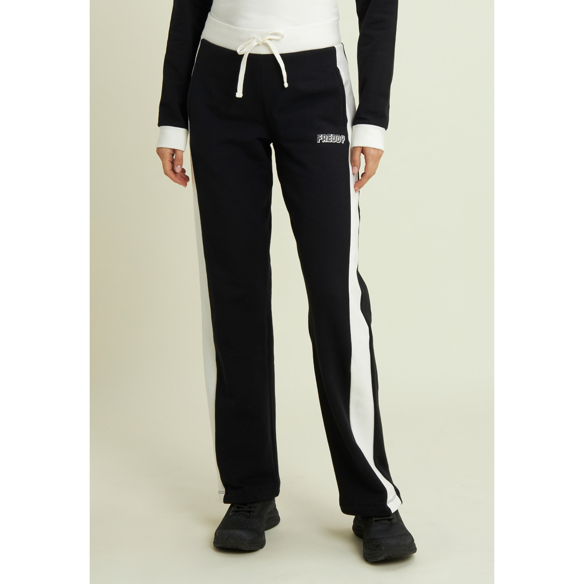 Pantaloni neri con bande laterali bianche