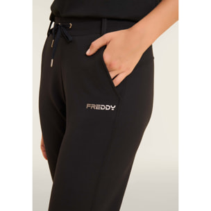 Pantaloni slim fit con spacchi laterali