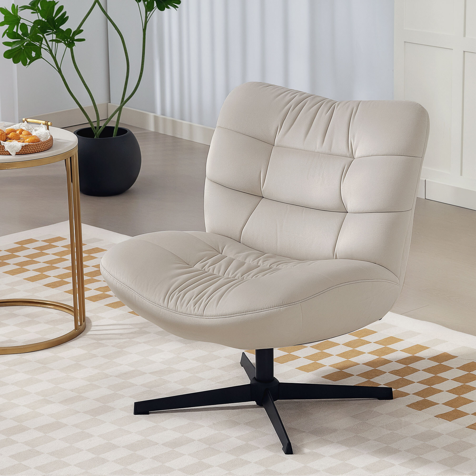 Fauteuil lounge effet matelassé grand confort pivotant piètement acier croisé noir tissu chenille grège