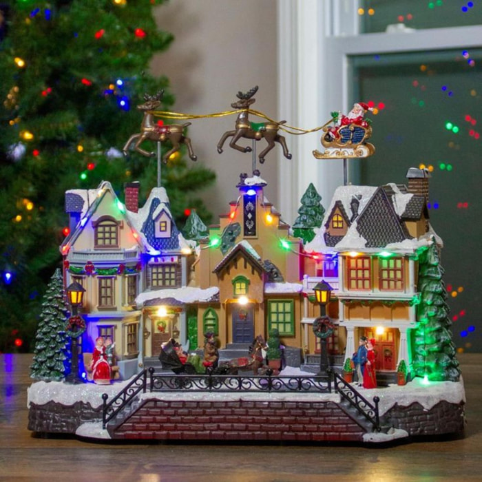Casa navideña village con 24 luces led multicolor con sonido