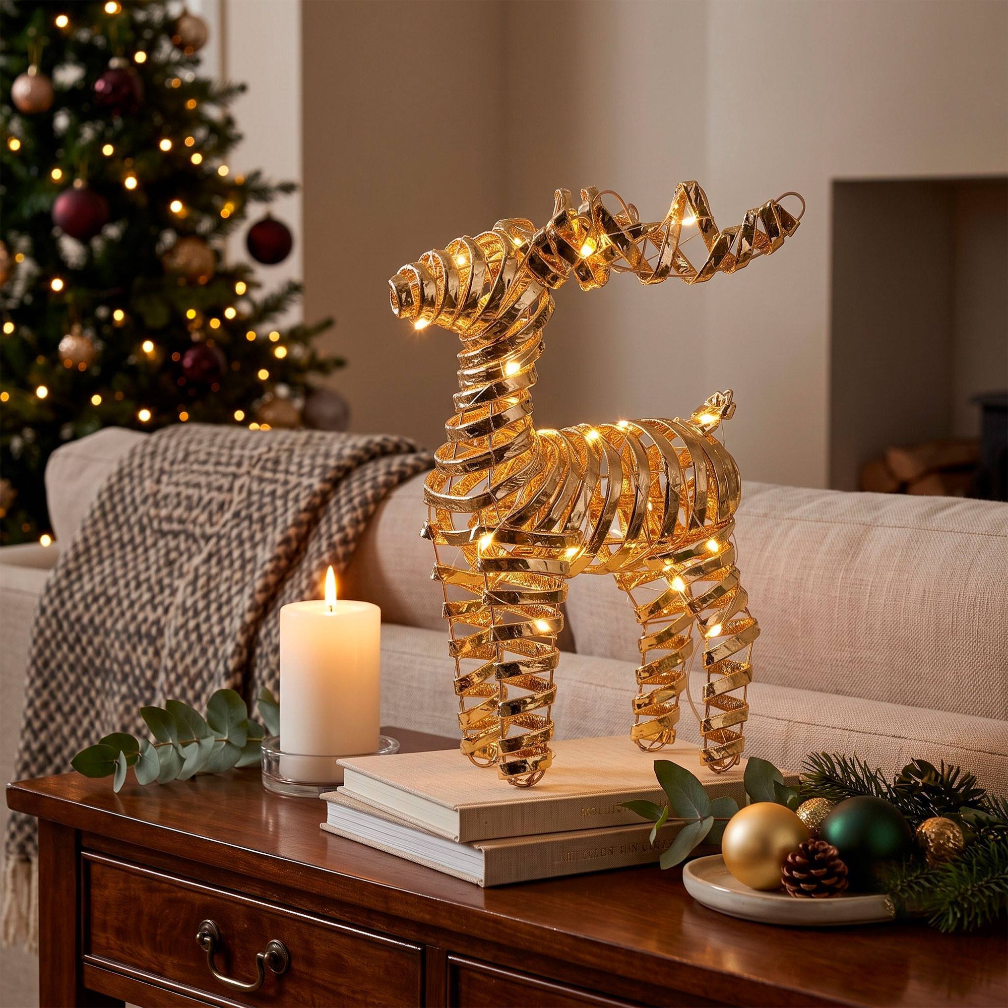 Reno navideño led dorado con 25 microled blanco cálido, con temporizador 20x7x34 cm