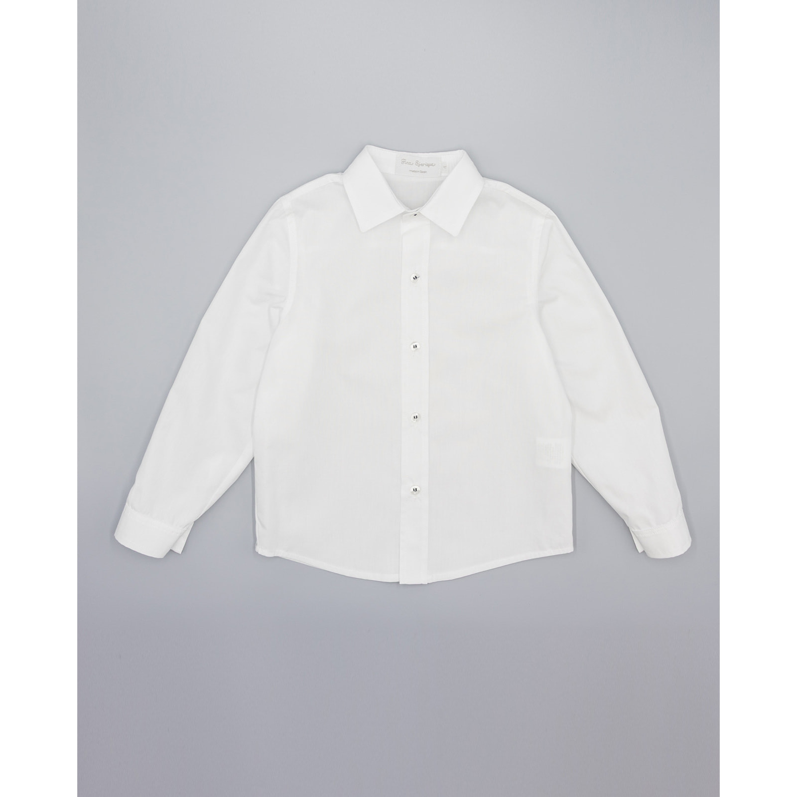 Camisa de popelín blanco manga larga. Con cuello italiano.