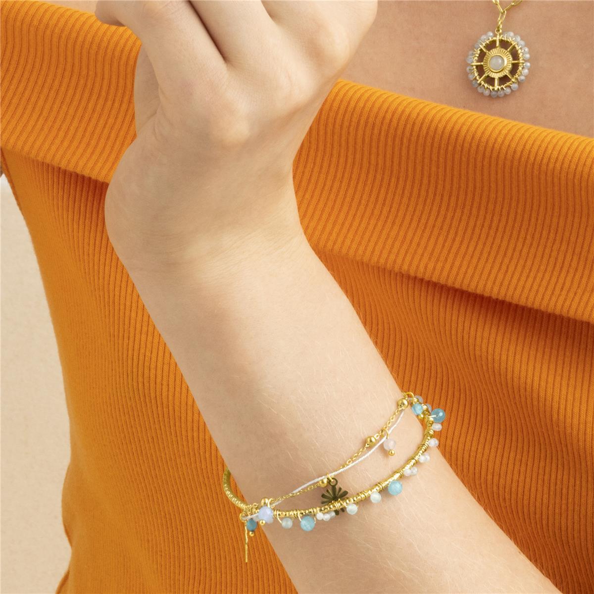 Brazalete con Cristal Azul acabado oro 18k