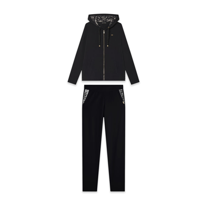 Tuta donna con zip, cappuccio e dettagli animalier