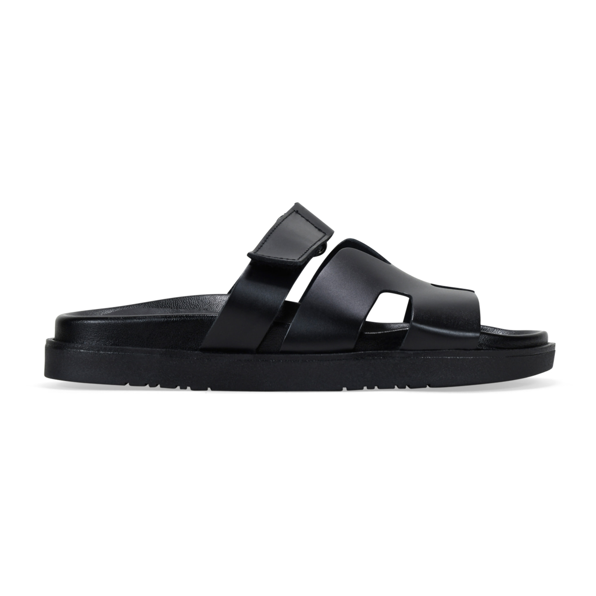 Sandalias planas negras en piel