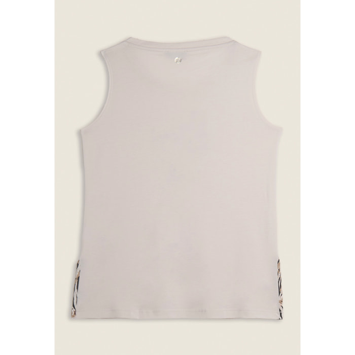 Canotta con fondo svasato e grafica con borchie