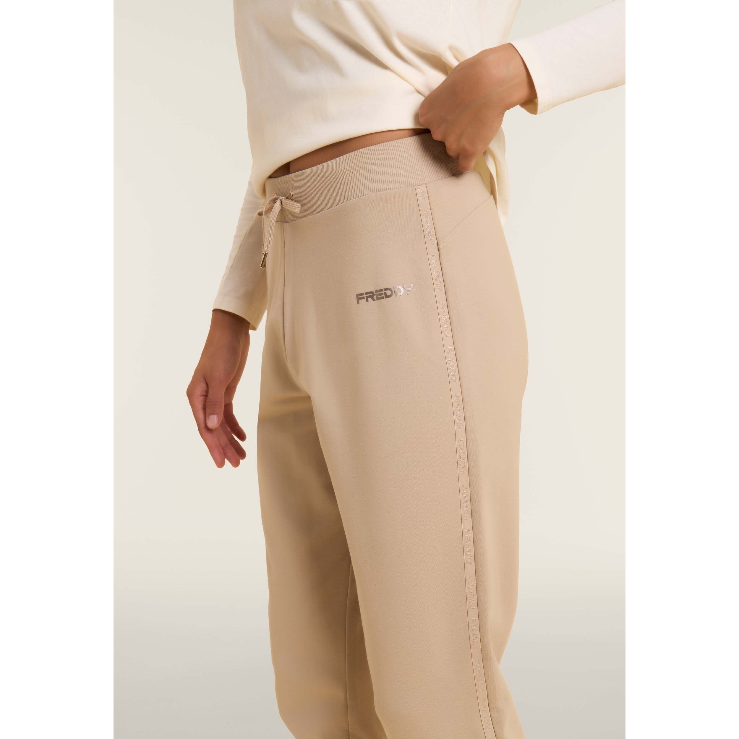 Pantaloni con fondo a costina e bande logate