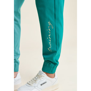 Pantaloni con elastico sul fondo e dettagli floreali