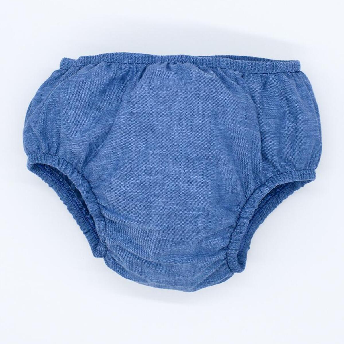 Cubrepañal de chambrai azul. Elastico en la cintura y en las piernas.