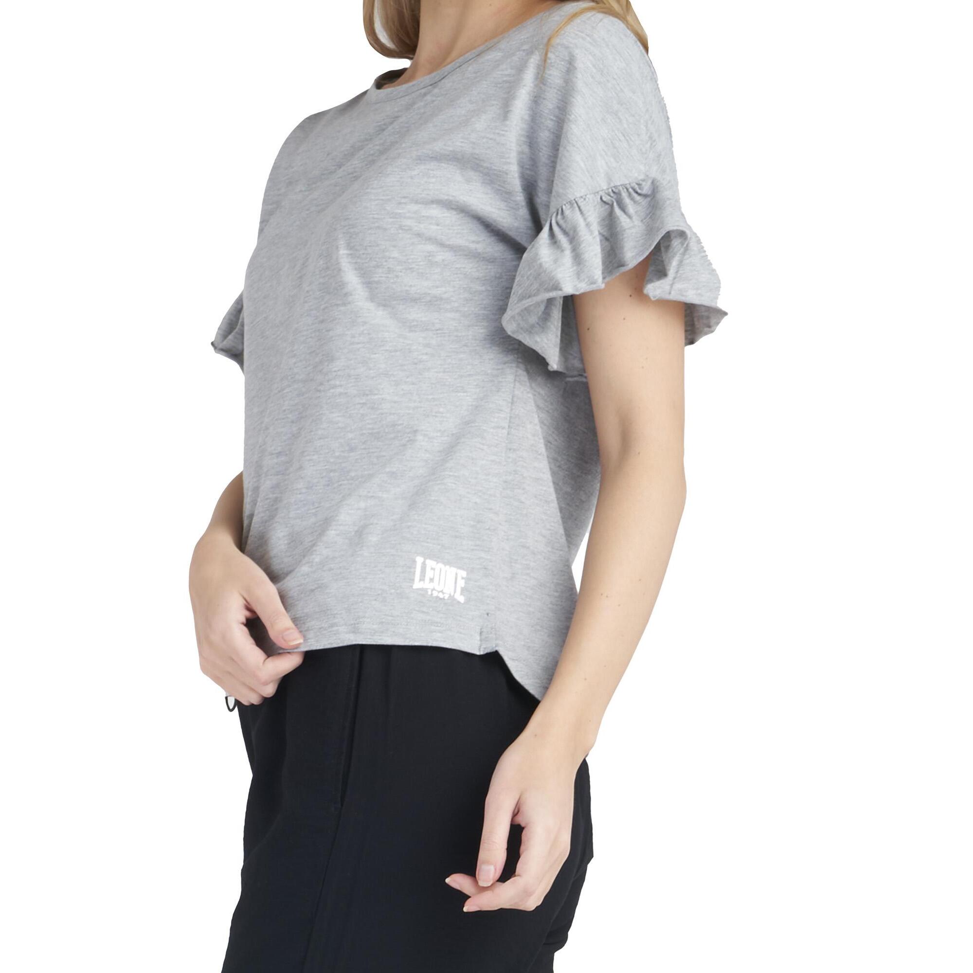 Camiseta de mujer brillante de manga corta con volantes