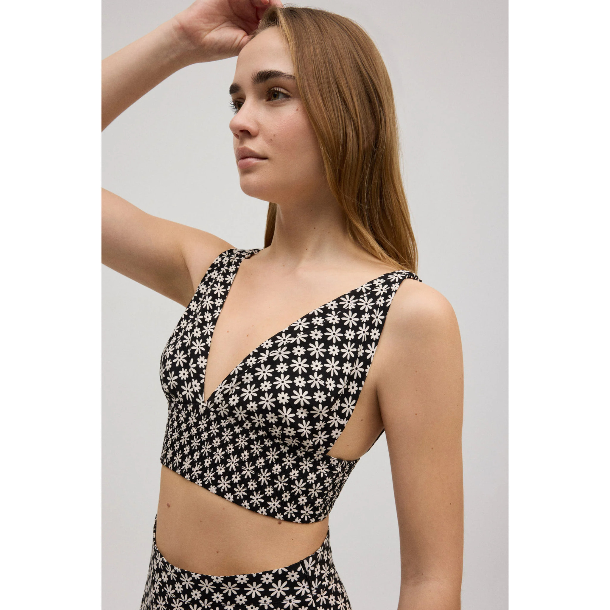 Crop top a nido d'ape con spalline elastiche a stampa floreale