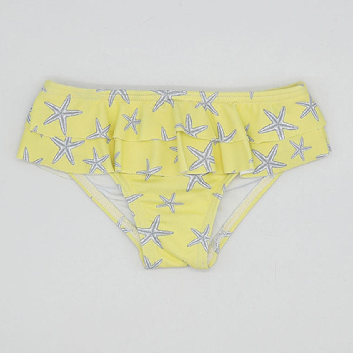 CULETÍN LYCRA ESTRELLAS AMARILLAS DOS VOLANTES