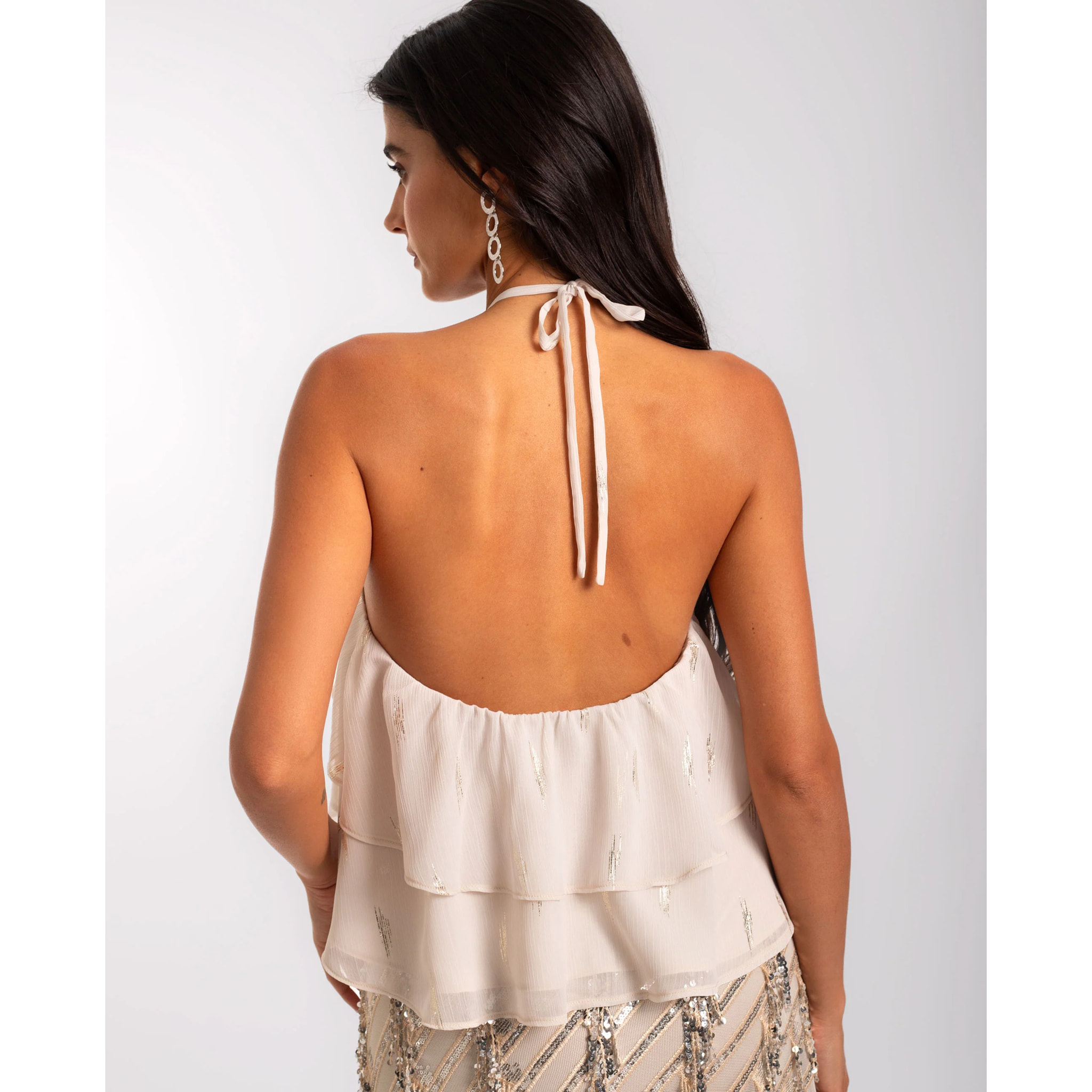 Top de mujer de gasa con volantes y cuello halter ajustable.