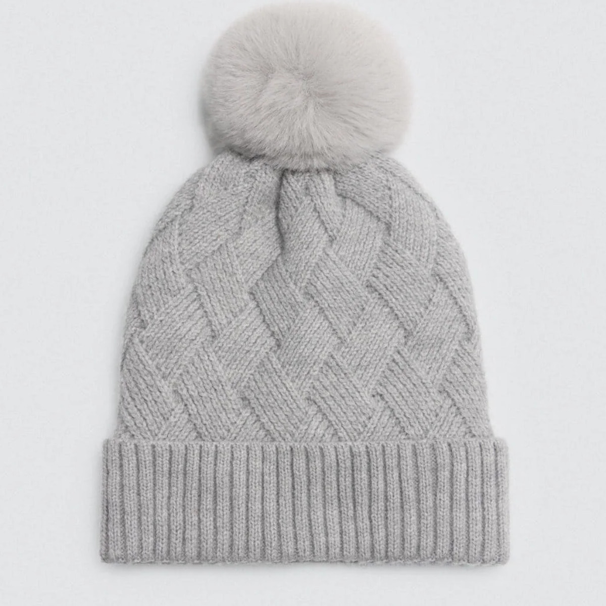 Cappello di peluche con pompon
