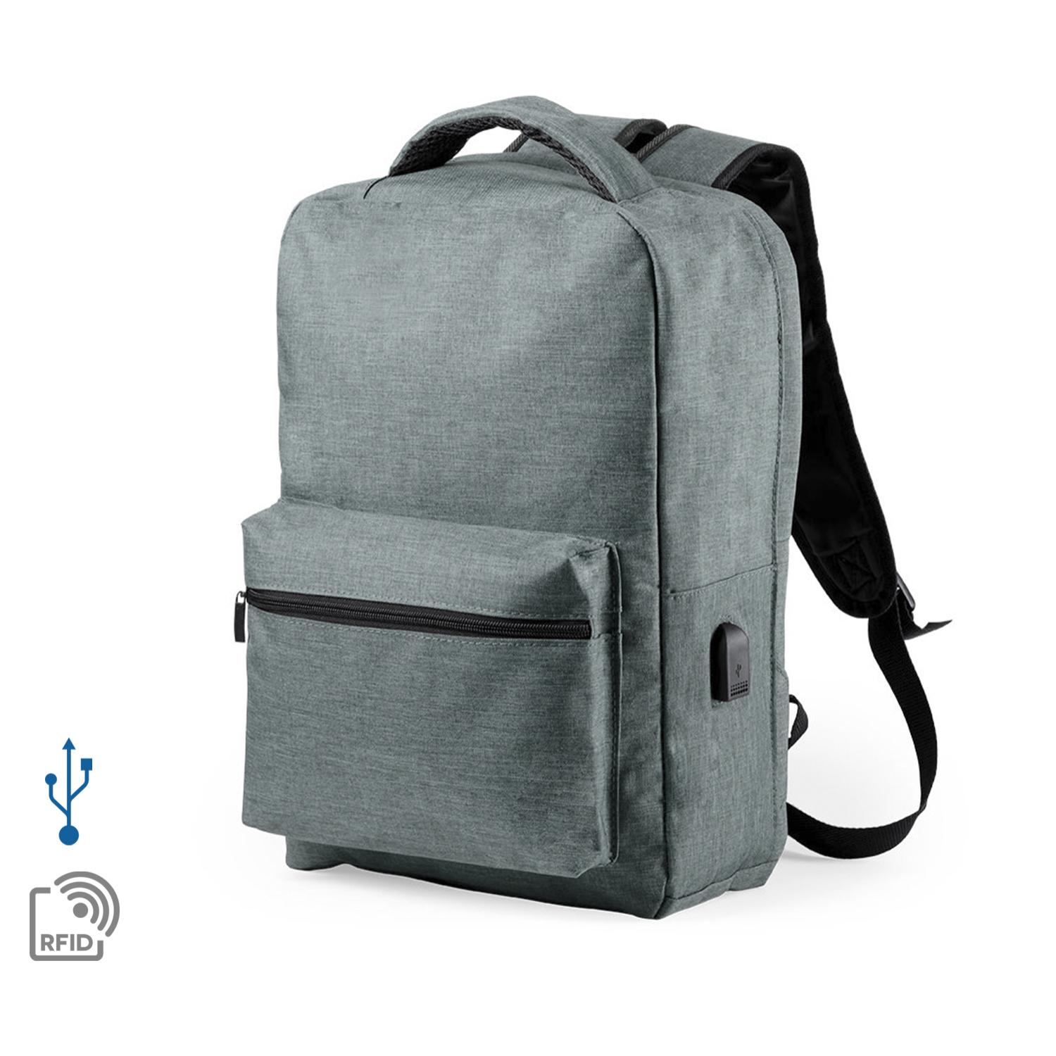 Mochila antirrobo Komplete de poliester 300D, con toma USB exterior. Bolsillo en lateral con protección RFID.