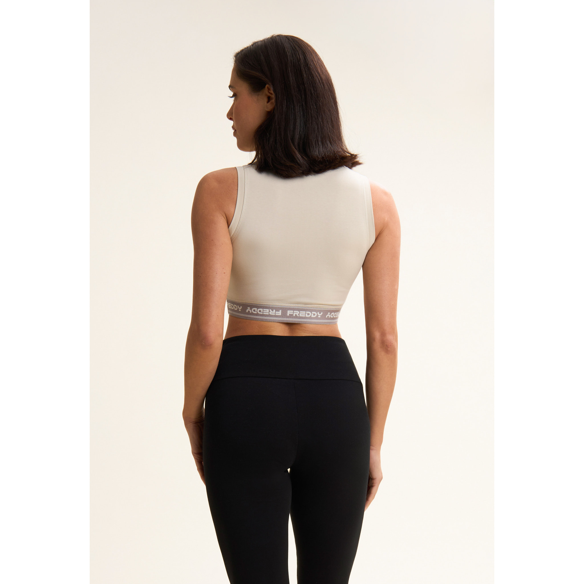 Top sportivo in heavy jersey stretch con elastico logato
