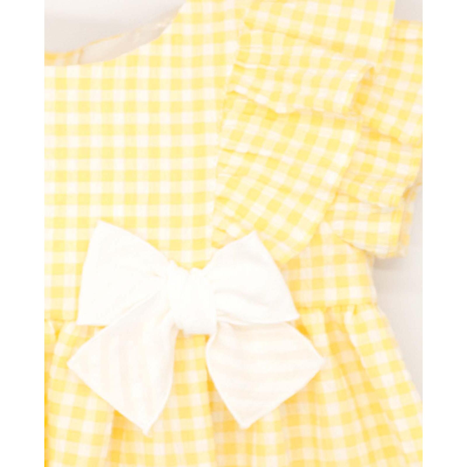 Vestido corto estampado de vichy amarillo, con volante y lazo.