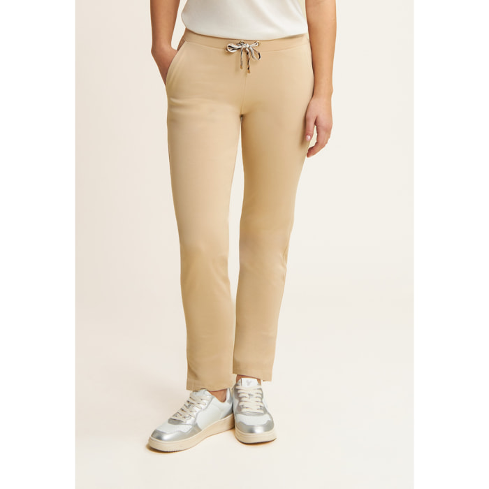 Pantaloni regular con spacchi e coulisse animalier