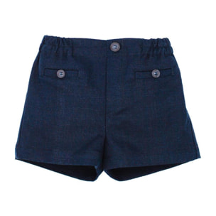 Bermuda de lino azul marino. Bolsillos falsos y botones, cintura elastica.