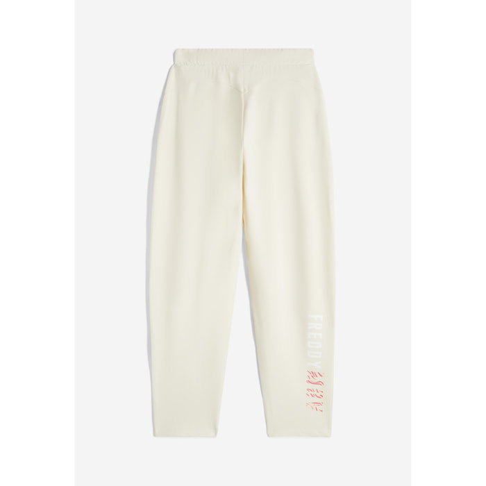 Pantaloni carrot fit in french terry con grafica sul fondo