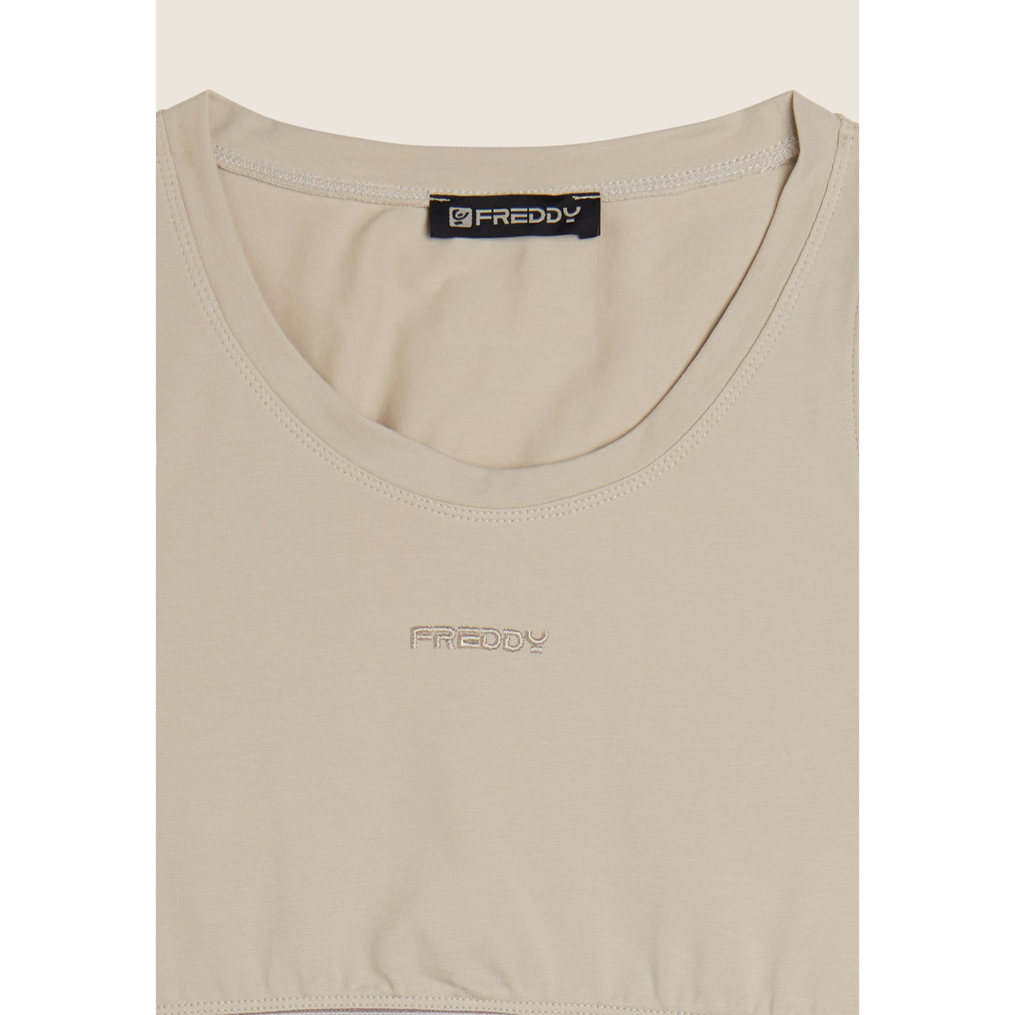 Top sportivo in heavy jersey stretch con elastico logato