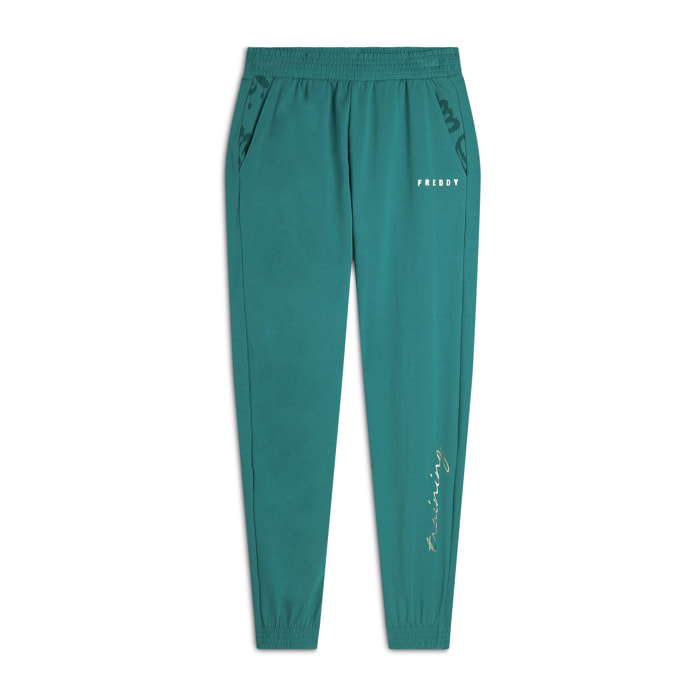 Pantaloni con elastico sul fondo e dettagli floreali