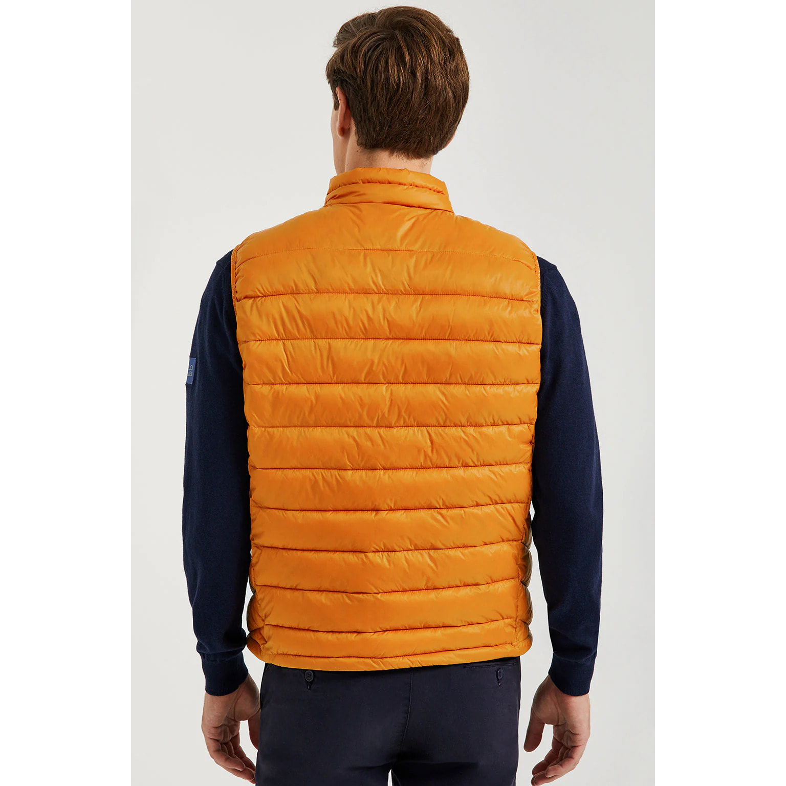 Chaleco naranja Pavel reciclado y ultraligero con etiqueta textil Polo Club