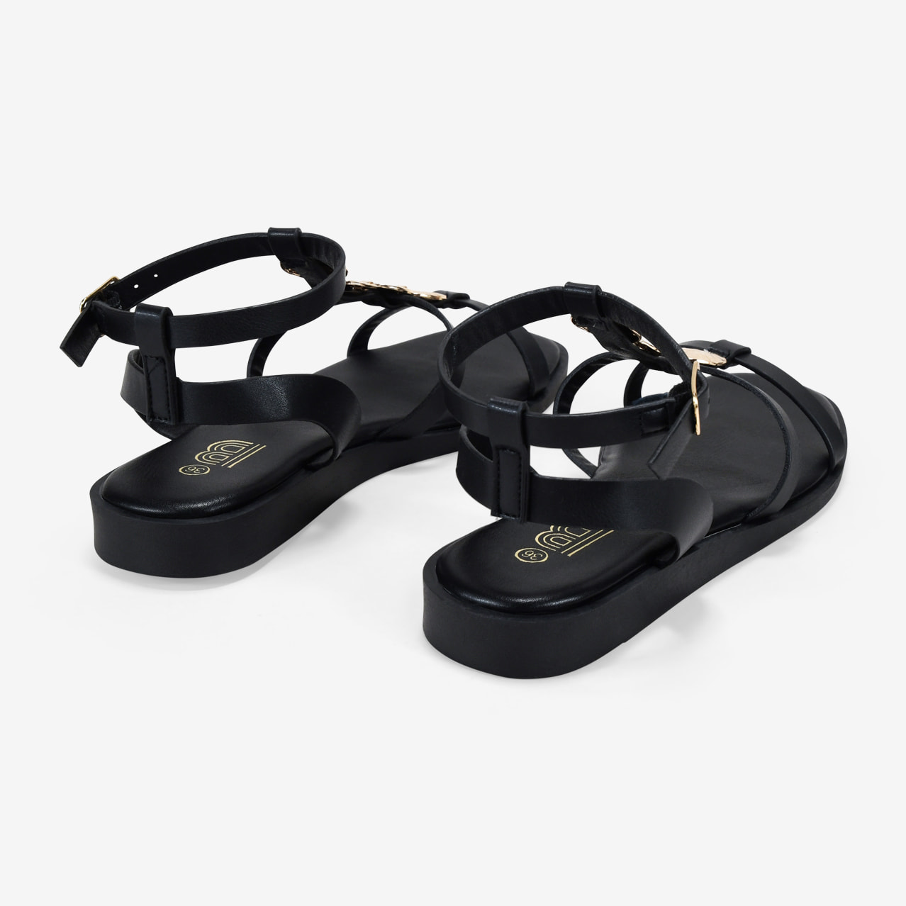 Sandalias planas negras con monedas doradas