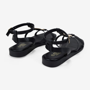Sandalias planas negras con monedas doradas