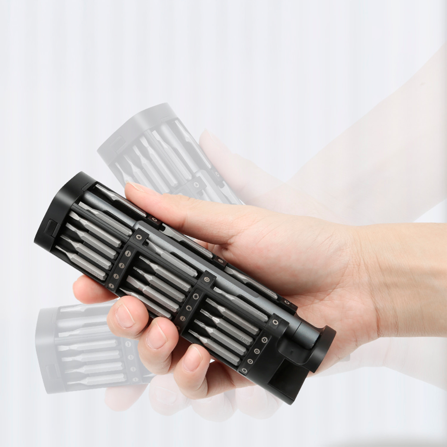 Destornillador de precisión 46 en 1 con cuerpo metálico, rosca giratoria, puntas magnéticas y carcasa de aleación de aluminio con apertura por presión.