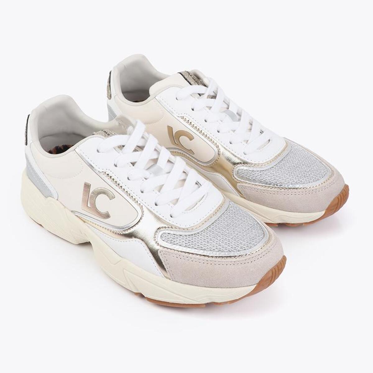 Scarpa sportiva con suola in stile running, caratterizzata da tessuti abbinati e dettagli in pelle.