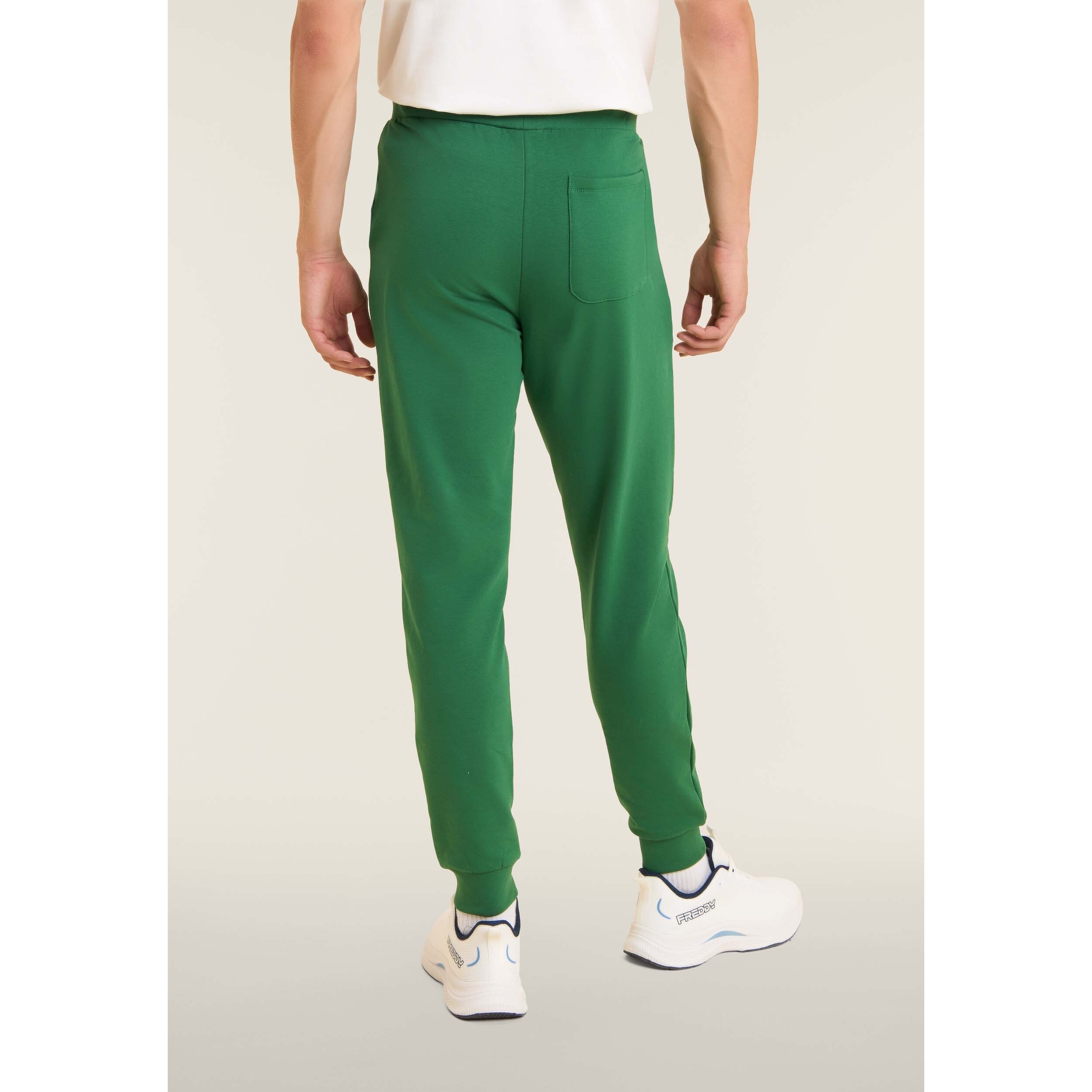 Pantaloni slim in interlock con maxi logo in rilievo