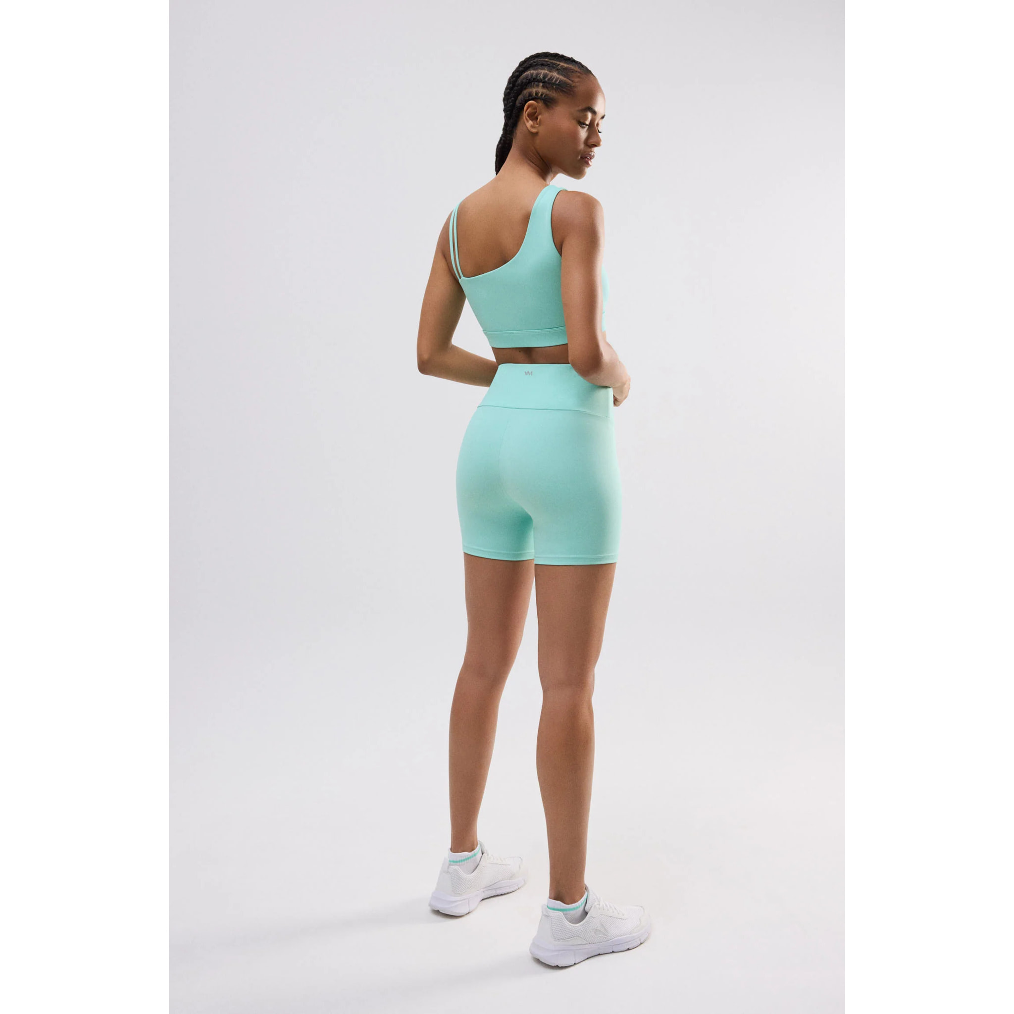 Reggiseno sportivo asimmetrico con supporto leggero in azzurro