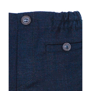 Bermuda de lino azul marino. Bolsillos falsos y botones, cintura elastica.