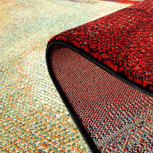 Petit tapis aux motifs multicolores abstraits