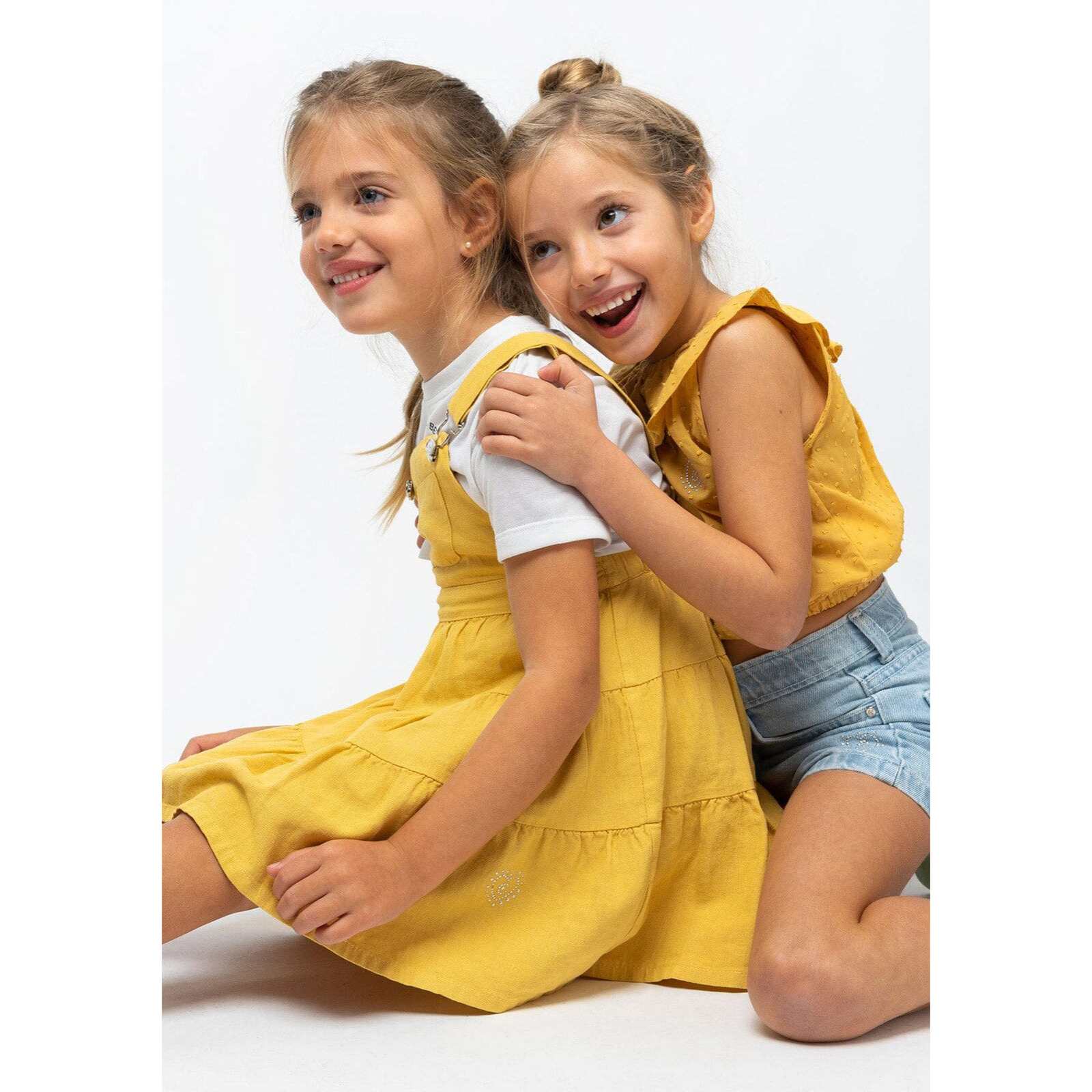 Top da bambina con volant color