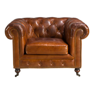 Sillón Chester con reposabrazos con asiento y respaldo tapizados en piel de origen vacuno en marrón coñac patas de madera maciza tintada en caoba 120x94x79cm