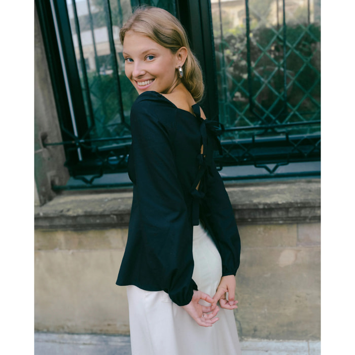 Blusa manga larga con lazadas en la espalda