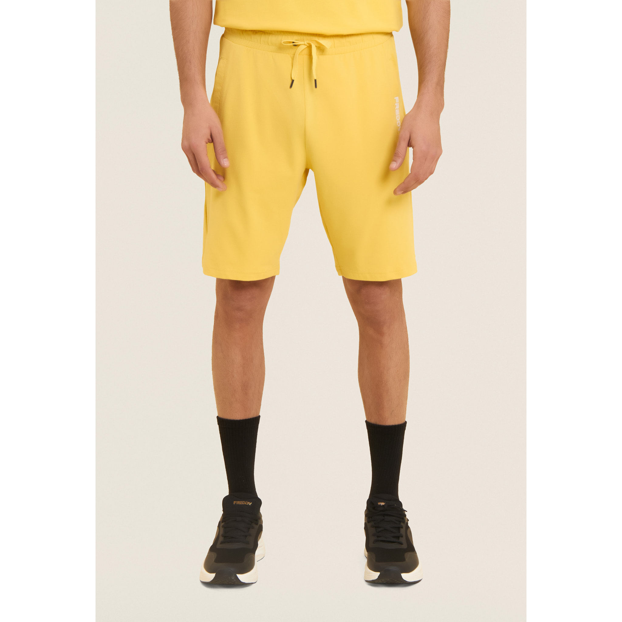 Pantaloni corti in jersey stretch con taschino