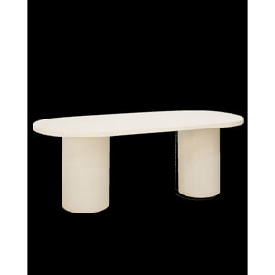 Table de salle à manger ovale en microciment de teinte blanc cassé disponible en différentes tailles