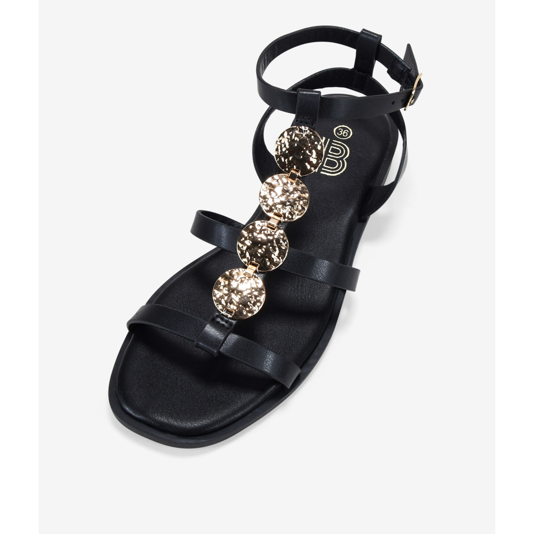 Sandalias planas negras con monedas doradas