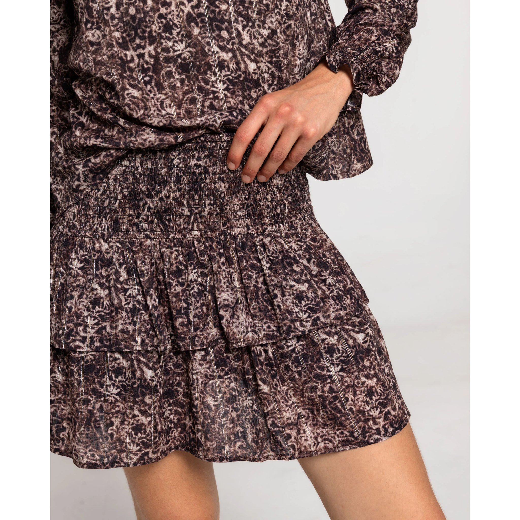 Mini falda estampada con nido de abeja y doble volante