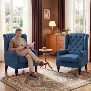 Fauteuil à oreilles style Chesterfield dossier capitonné grand confort bois noir tissu bleu