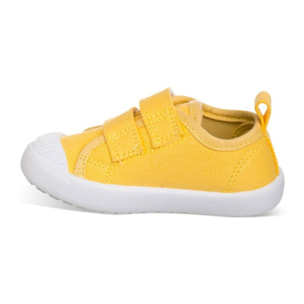 Lona color amarillo, fácil de combinar, con dos Velcros, puntera de goma y gran flexibilidad