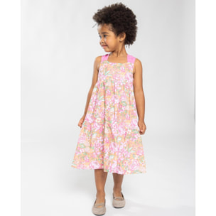 Vestido midi de popelín ocre flores rosas. Falda de volantes y tirantes cruzados en la espalda.